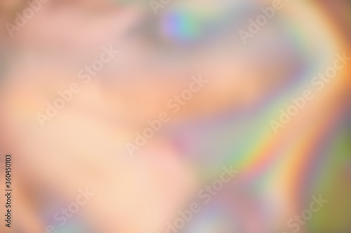 Abstract blurred holographic iridescent foil background. Trendy gradient with vivid colors photo