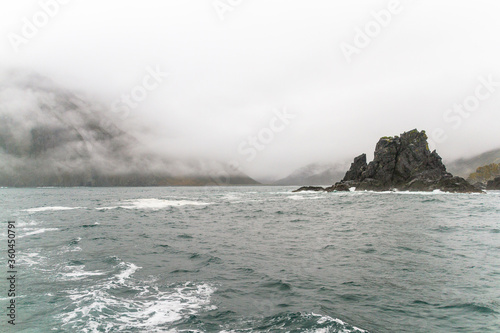 View of the sea bay during bad weather, fog, rain, strong wind