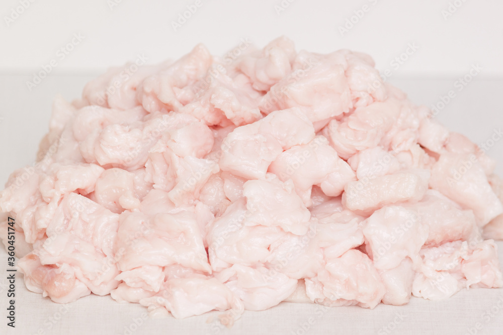 Pork fat lard cut into pieces on a table. Melting for fry. Not carcinogenic concept. Pork fat lard cut into pieces on a table. Melting for fry. Not carcinogenic concept.