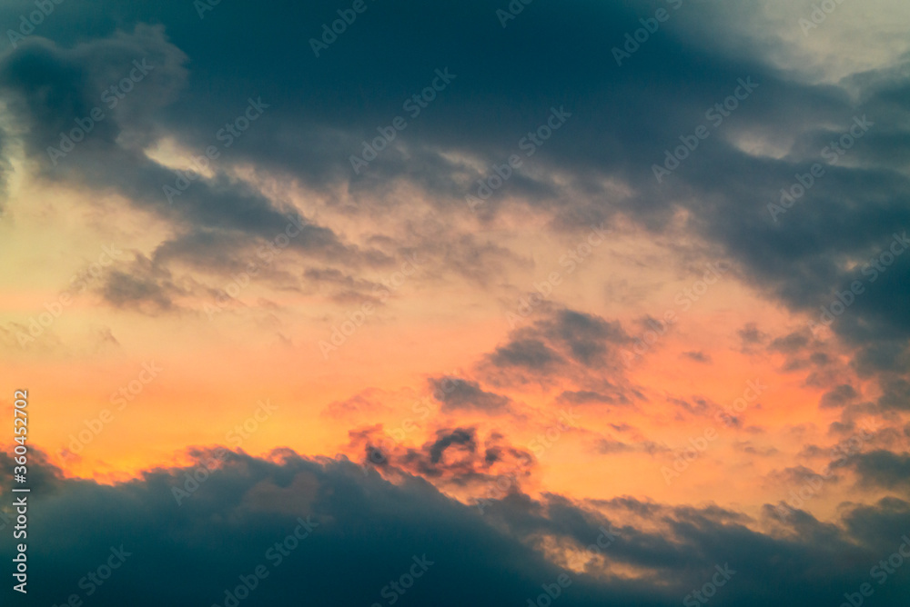 Fototapeta Dramatic gray cloud with red sunset sky