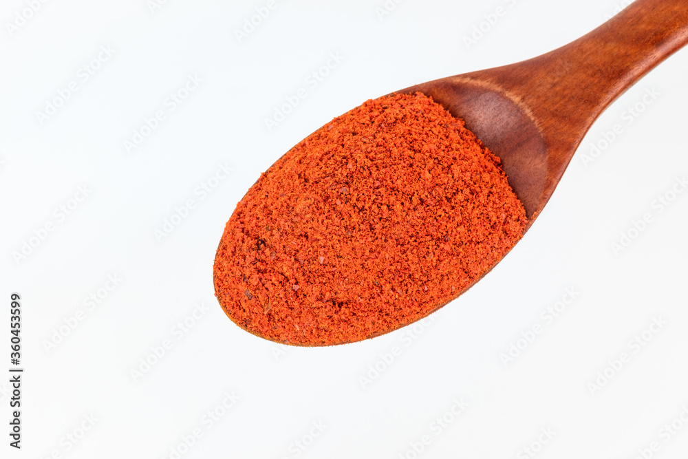 Red pepper powder on white background Red pepper powder on white background