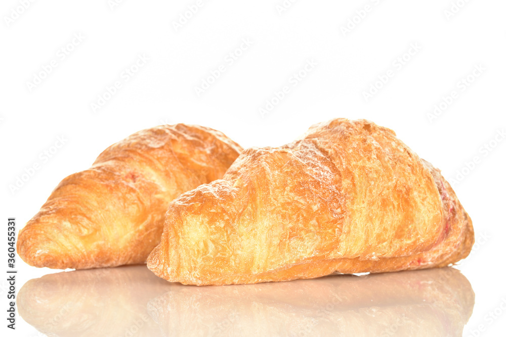 Homemade croissants, close-up, on a white background.