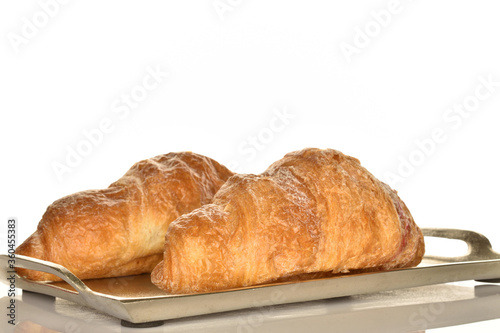 Homemade croissants, close-up, on a white background.