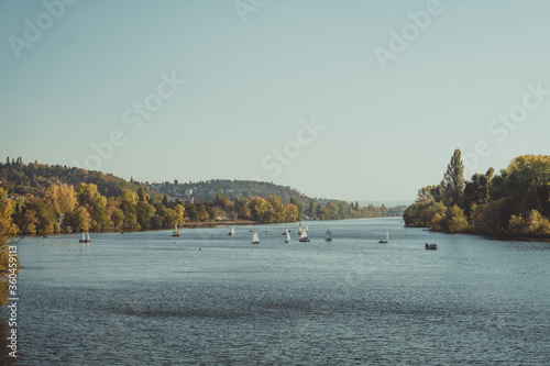 Sunny morning with yachts on the Vltava river