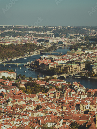 Bird's eye view of Prague's old town red roofs sliced by the Vltava river