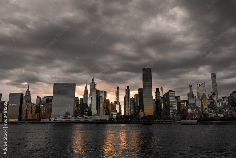 Dark and Ominous Sky with the Midtown Manhattan Skyline during a Sunset along the East River in New York City