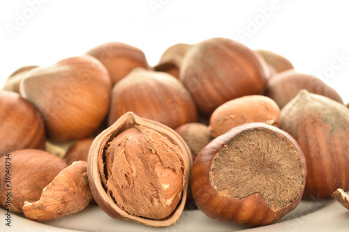 Hazelnuts, macro, on a white background.