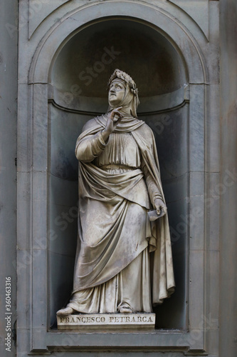 Statue of Francesco Petrarca, famous italian poet, outdoor the uffizi museums, Florence, Italy photo