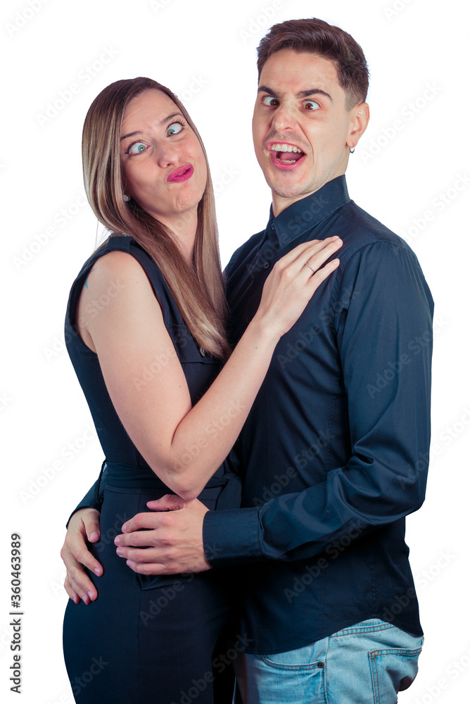 Young couple making funny faces and gestures on a white background