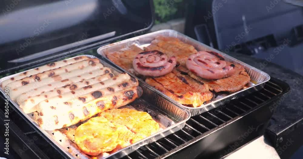 Grill meat and sausages on a grill Grill meat and sausages on a grill