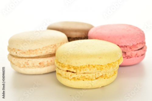 Tasty multi-colored, sweet macaroons, on a white background.