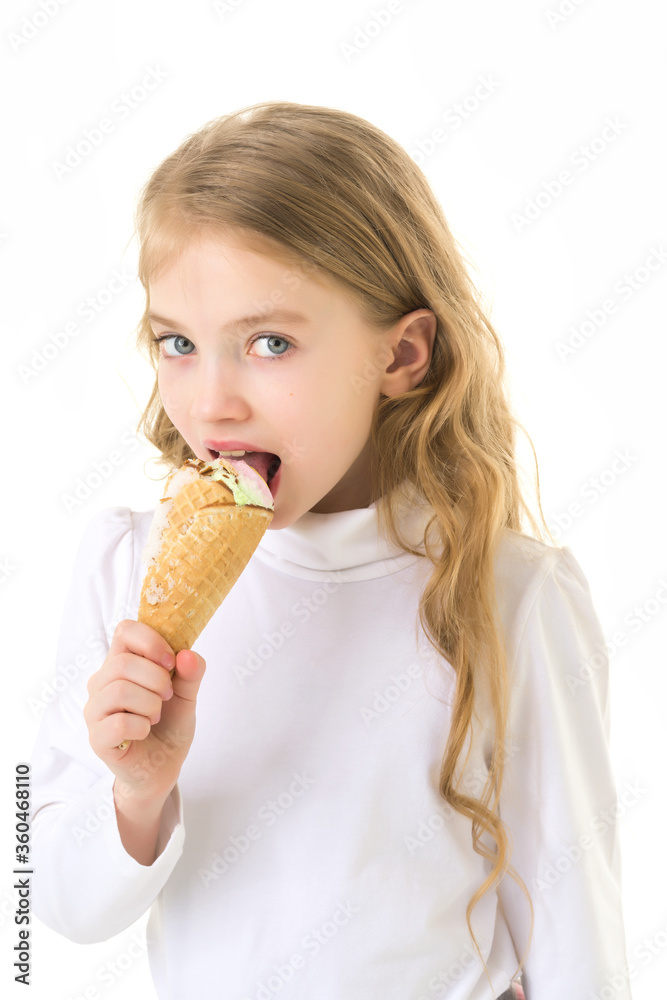 Little girl gently licks a very cold ice cream. Little girl gently licks a very cold ice cream.
