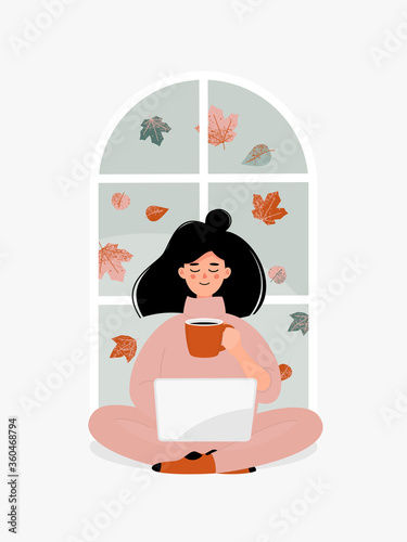 Vector brunette woman drinking a cup of tea or coffee and working on laptop by window with autumn leaves