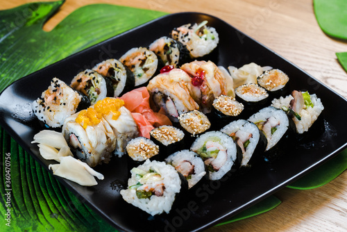 Sushi and roll set on wooden table. Selective focus