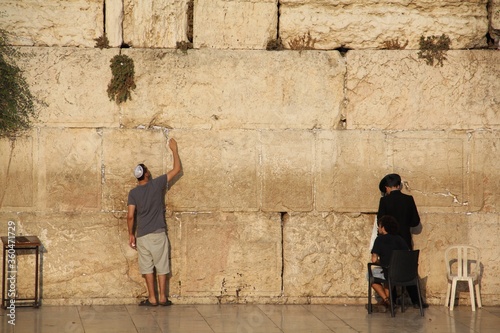 Jewish people praying to the Jerusalem's western wall, the wailing wall