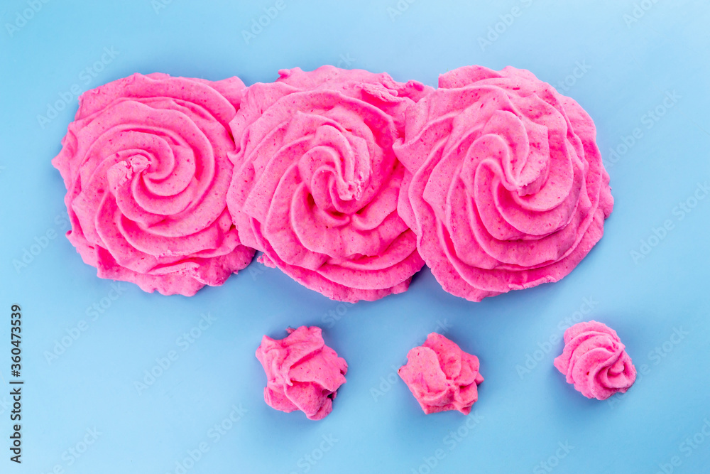Pink marshmallows on a blue background Pink marshmallows on a blue background