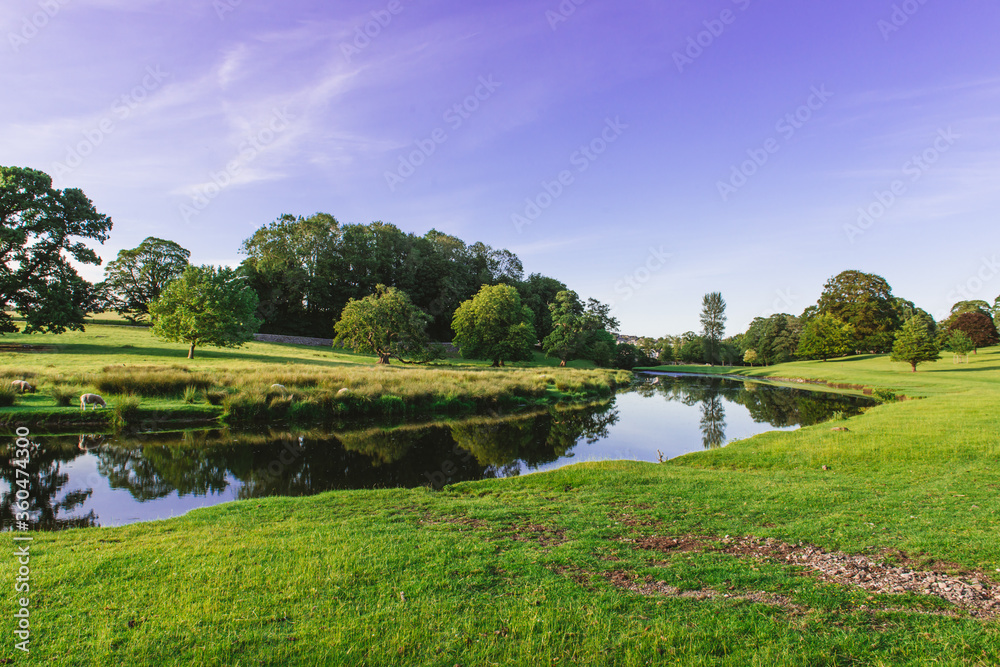 a bend in the River Bela at Dallam Park, Milnthorpe, Cumbria, England a bend in the River Bela at Dallam Park, Milnthorpe, Cumbria, England
