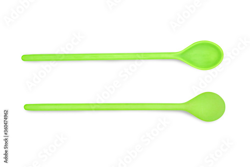 Green plastic spoon isolated on white background with clipping path.