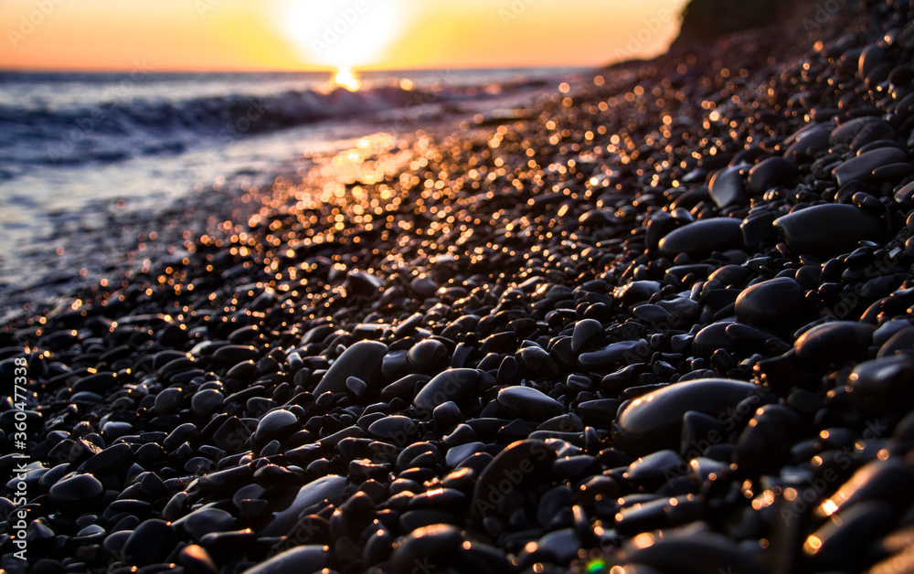 Fototapeta premium Pebble beach sunset in Russia