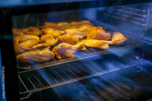 Chicken wings in the oven with evening light