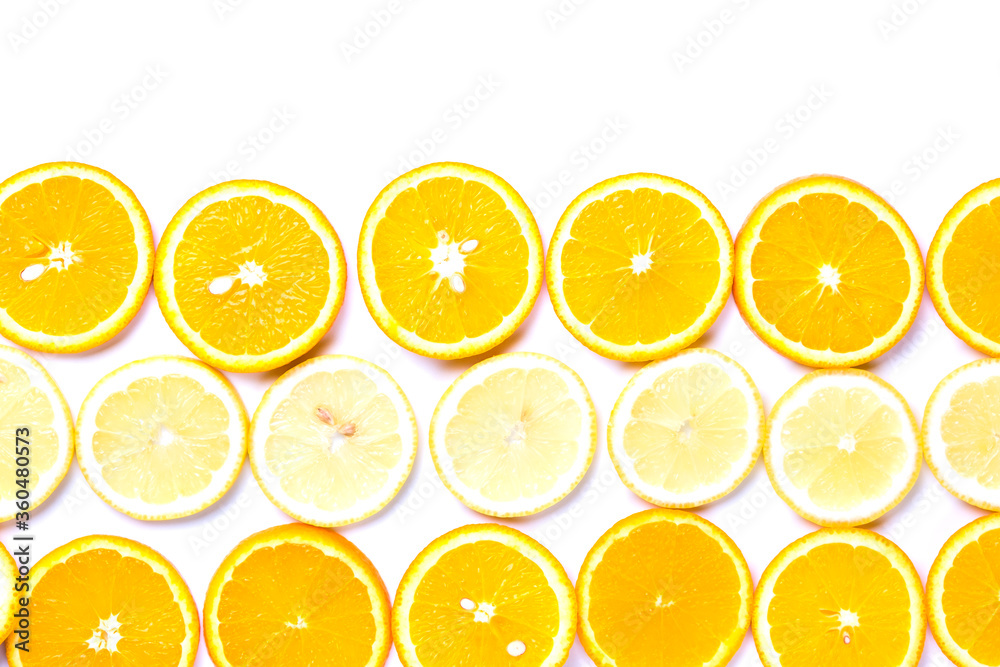 Flat lay view of orange and lemon slices on white backround.