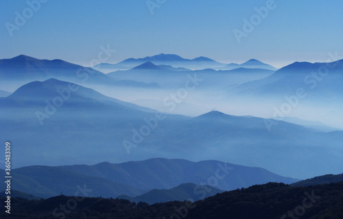 Dawn of the mountain with the sea of clouds, blue fog nature sky mountain mist. Landscape blue mountains