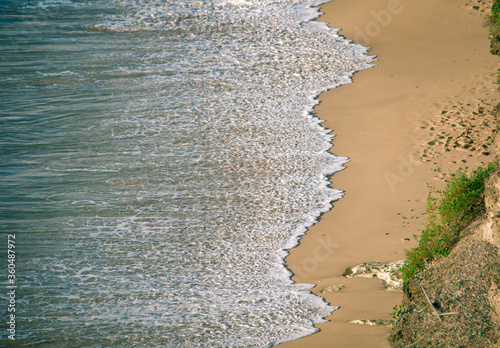 Water on the shore of a sandy beach