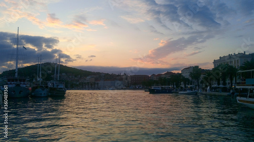 Beautiful sunset view over the port. Split seaport is located in the middle of Croatia, on the Adriatic coast, in a cozy bay, protected by breakwaters.