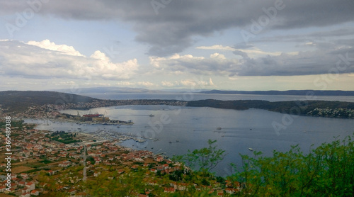 Panoramic image of the bay with tiled roofs, picturesque mountains and the bay. Croatia.