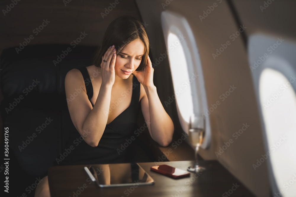 Attractive woman in private jet Attractive woman in private jet
