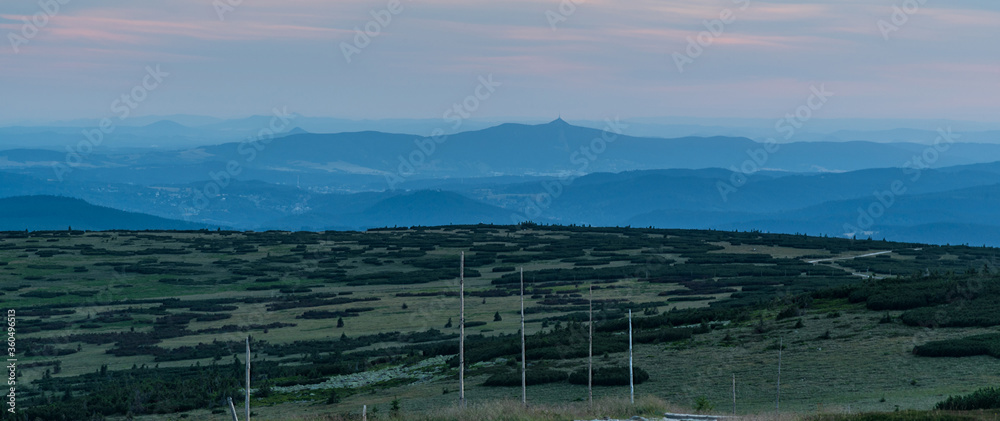 Jested hill with few other mountain ranges around from Vysoka Plan hill above Sniezne Kotly in Krkonose mountains after sunset Jested hill with few other mountain ranges around from Vysoka Plan hill above Sniezne Kotly in Krkonose mountains after sunset