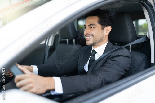 Smiling Male Business Executive Driving Car © AntonioDiaz