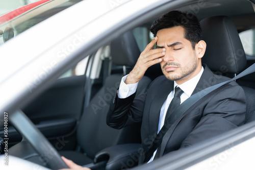 Tired Businessman Driving Car © AntonioDiaz