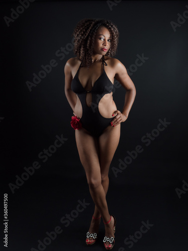 Sensual and attractive African American woman wearing a one piece swimsuit