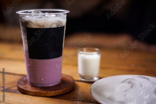 variant of cold drinks with fruit flavor. fresh cafe menu with dark background. colorful ice mockups with plastic cups. grape, chocolate, strawberry, mango, grass jelly, blueberries, guava