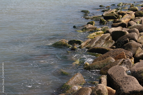 Sea pebble. Sea stones background. Ocean beach rocks.