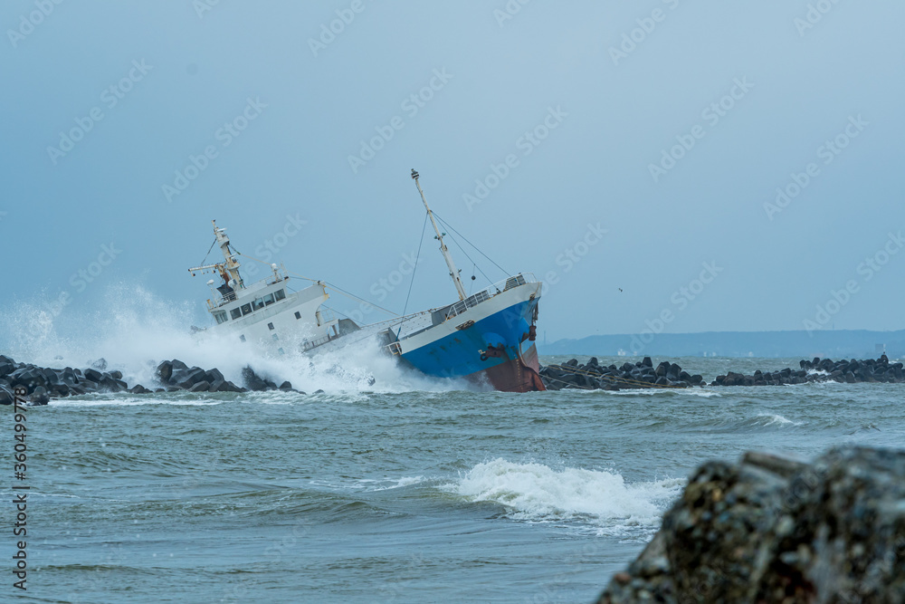 Cargo ship run aground on rocky shore / Hokkaido Japan