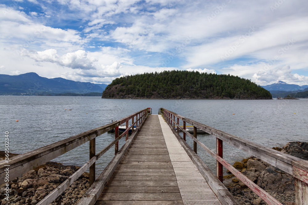 Beautiful View of a wooden Quay with Howe Sound and Hutt Island in Background. Taken in Bowen Island, British Columbia, Canada. Beautiful View of a wooden Quay with Howe Sound and Hutt Island in Background. Taken in Bowen Island, British Columbia, Canada.