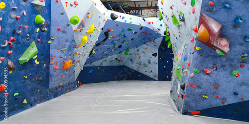 A general view of indoor climbing wall for climbing. Bouldering wall.