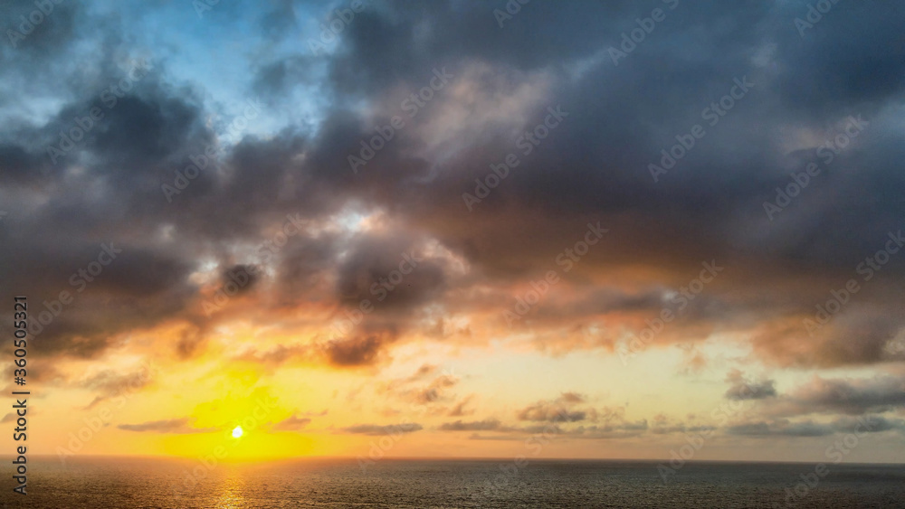 Fototapeta premium Amazing aerial view of beautiful sunset over the ocean