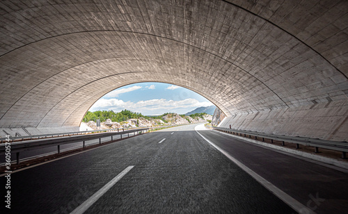 Freeway through the tunnel. Concrete car tunnel.