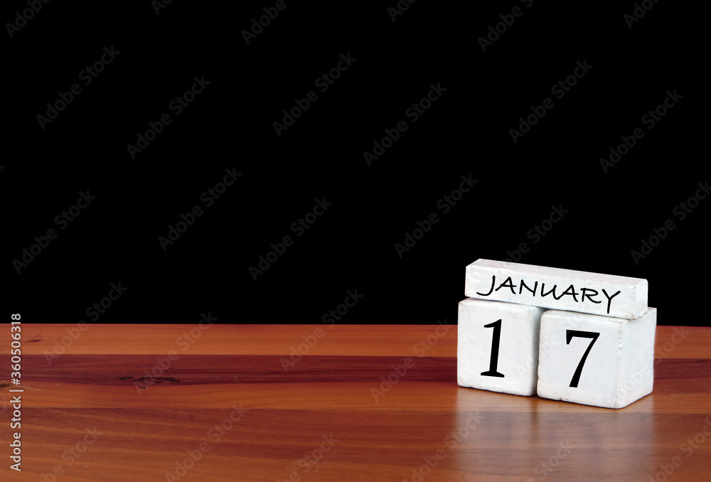 17 January calendar month. 17 days of the month. Reflected calendar on wooden floor with black background 17 January calendar month. 17 days of the month. Reflected calendar on wooden floor with black background