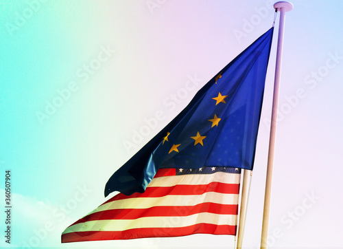 European union flag and American flag on blue sky