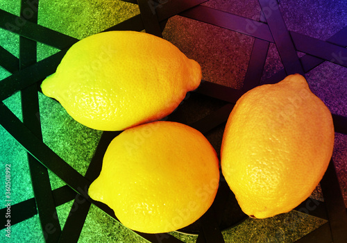 Three fresh ripe lemons . Top view. 