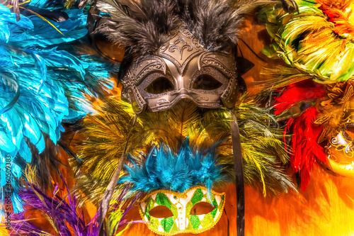 Fototapeta Naklejka Na Ścianę i Meble -  Colorful Green Black Masks Blue Feathers Mardi Gras New Orleans Louisiana