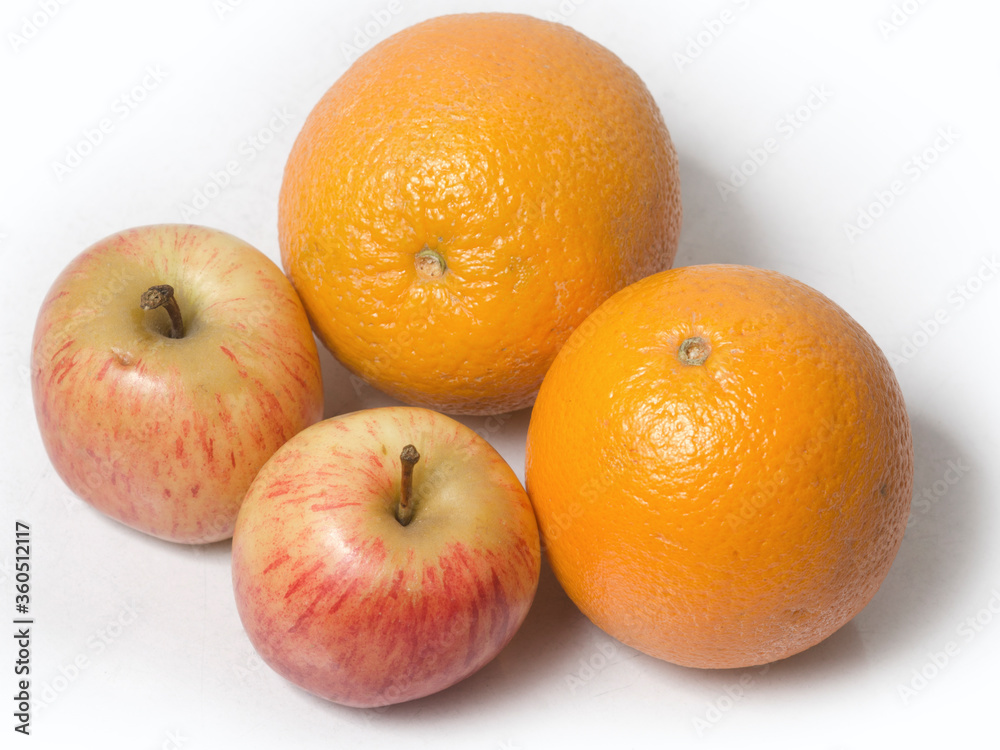 Two Apples and Oranges on isolated white background. close up. top angle. Two Apples and Oranges on isolated white background. close up. top angle.