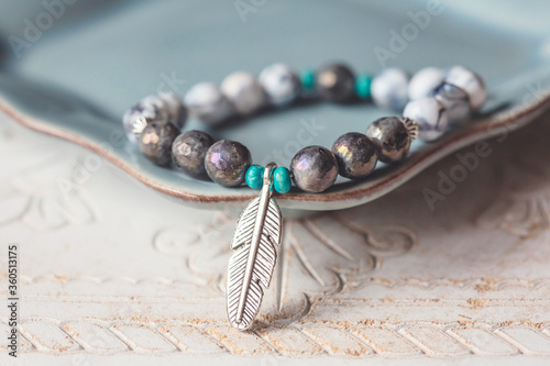 Electroplated fazeted labradorite mineral stone beads bracelet with feather pendant photo