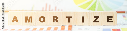 word amortize made with letters on wooden blocks on desk