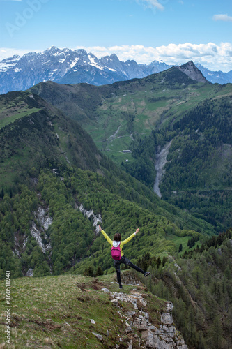 woman hiker in mountains enjoying the view