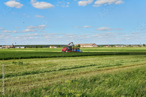 agricultural landscape with combine harvester